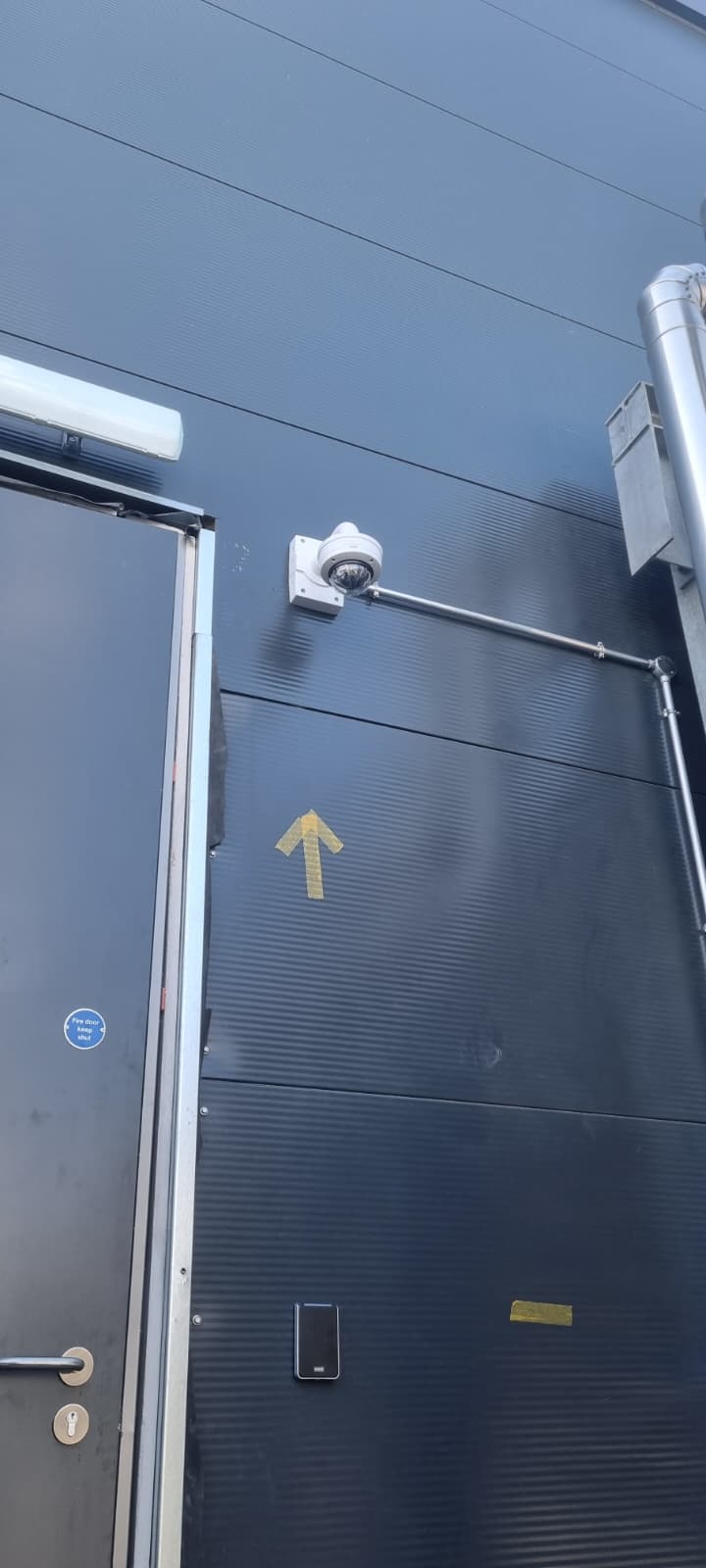 External CCTV camera installed on a steel-clad building